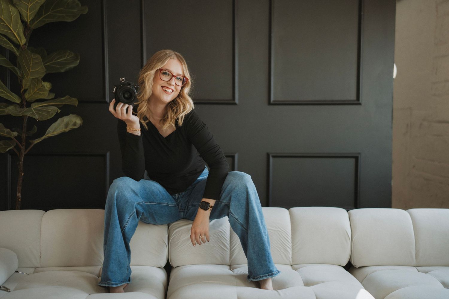 A series of mirror selfies showing hands holding a black vintage camera against a light background.