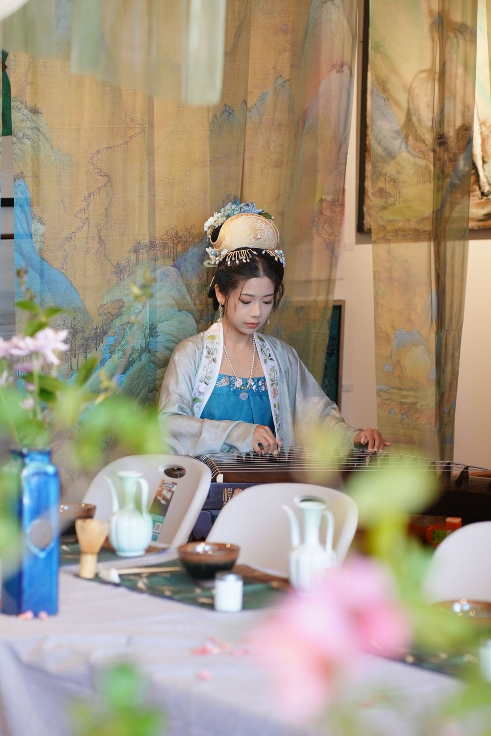 Event photography of diverse guests enjoying a traditional Chinese tea culture experience in Hanfu, by an Auckland photographer.