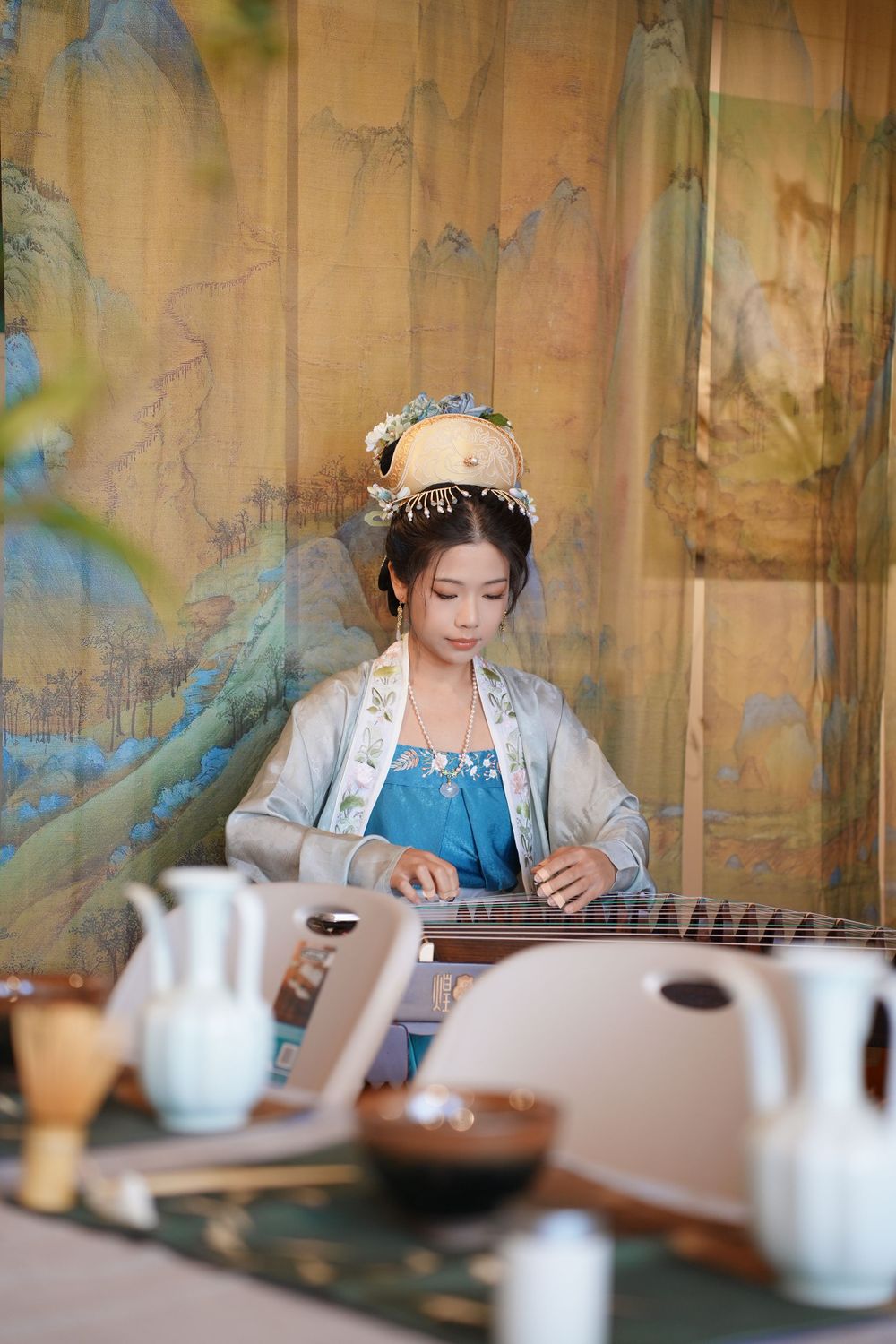 Event photography of diverse guests enjoying a traditional Chinese tea culture experience in Hanfu, by an Auckland photographer.