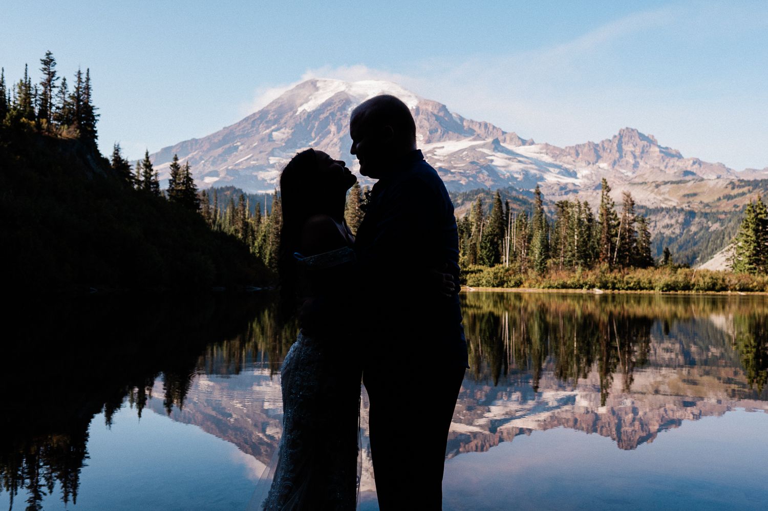 silhouette of a couple in front of Mt. Rainier. Photo by Pine + Vow