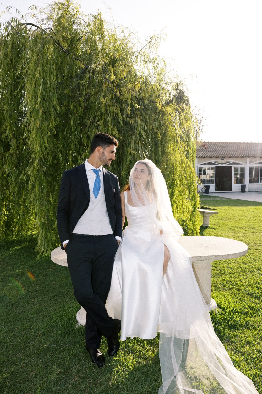 Bride and groom portrait with veil in garden at Palácio da Bacalhôa Portugal