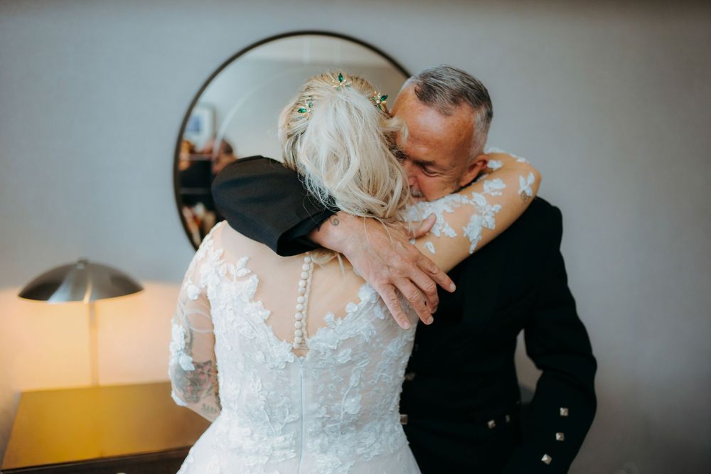 Romantic wedding couple sharing intimate moments in a series of candid black and white photographs.