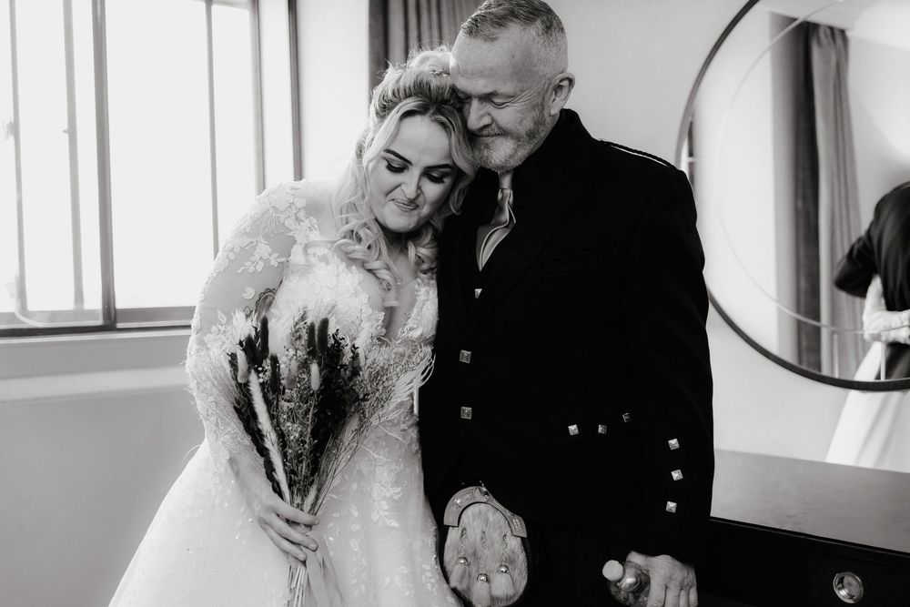 A black and white photo collage showing tender romantic moments between a couple on their wedding day.
