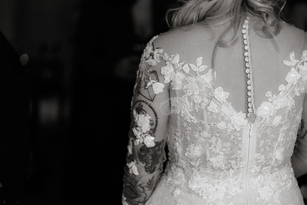 Collection of elegant wedding dress details featuring delicate white lace and floral embroidery patterns.