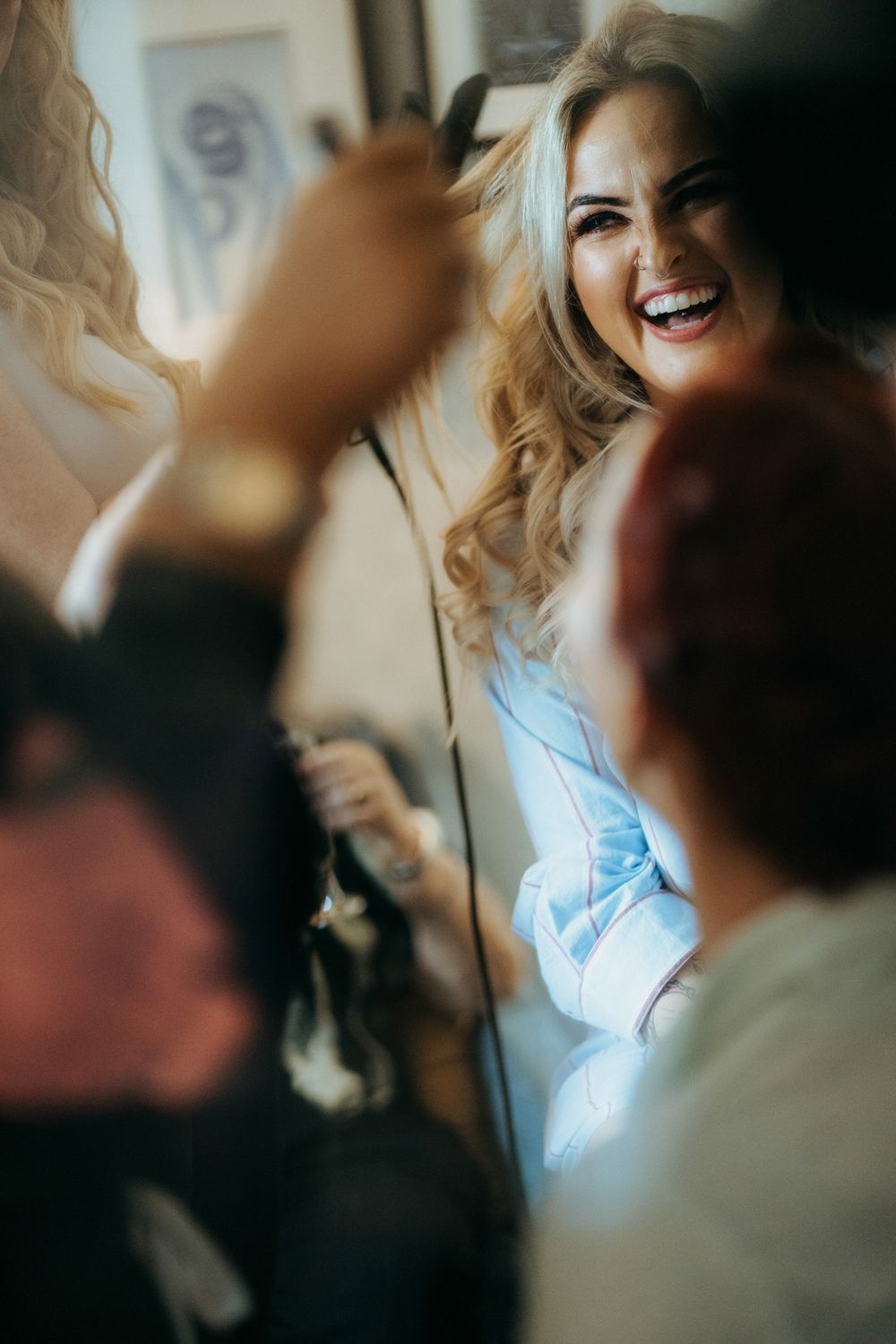 A series of blurred candid photos showing joyful expressions and natural interactions between people in soft lighting.