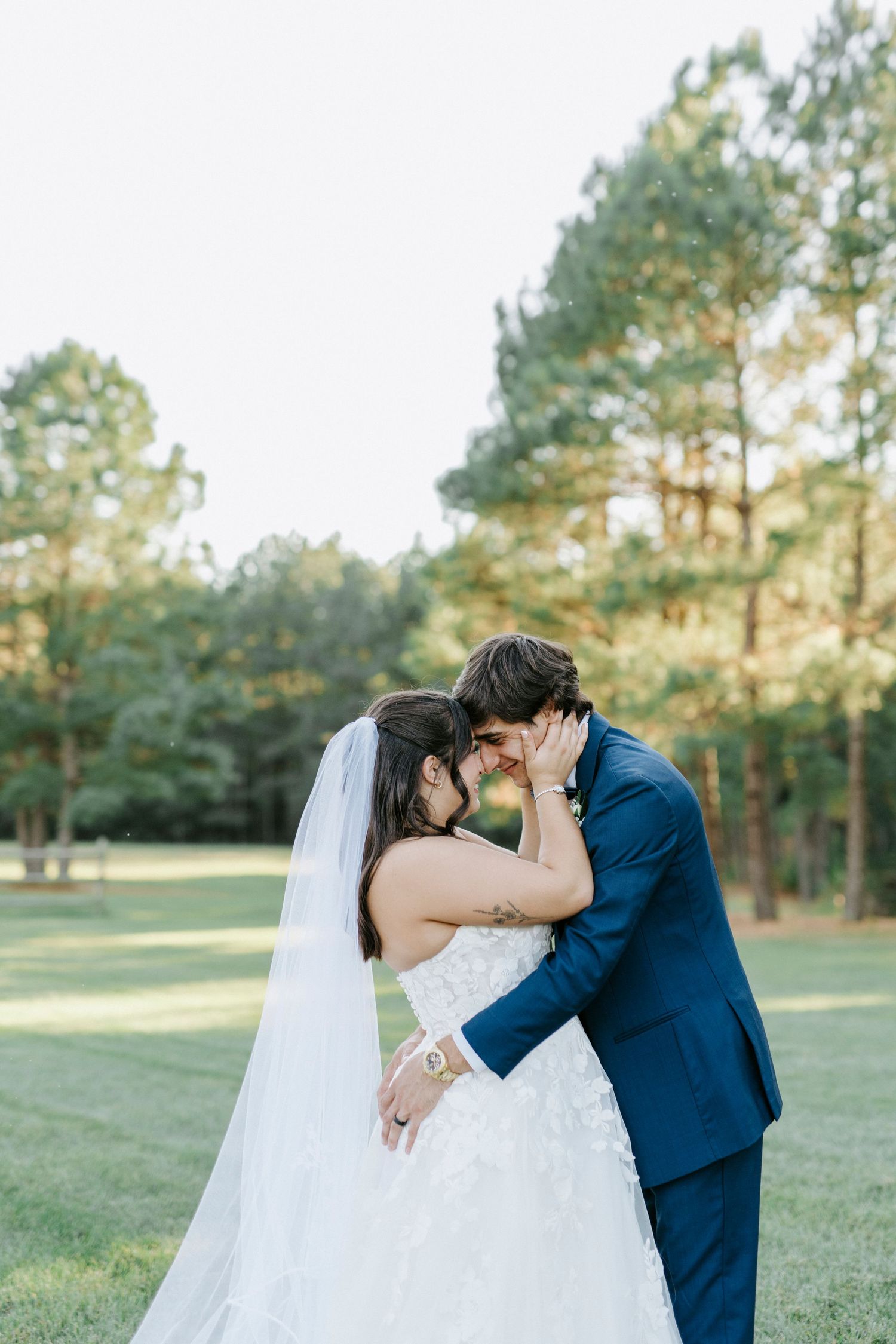 A romantic wedding photo sequence showing a couple sharing a kiss in a sunlit pine forest setting.