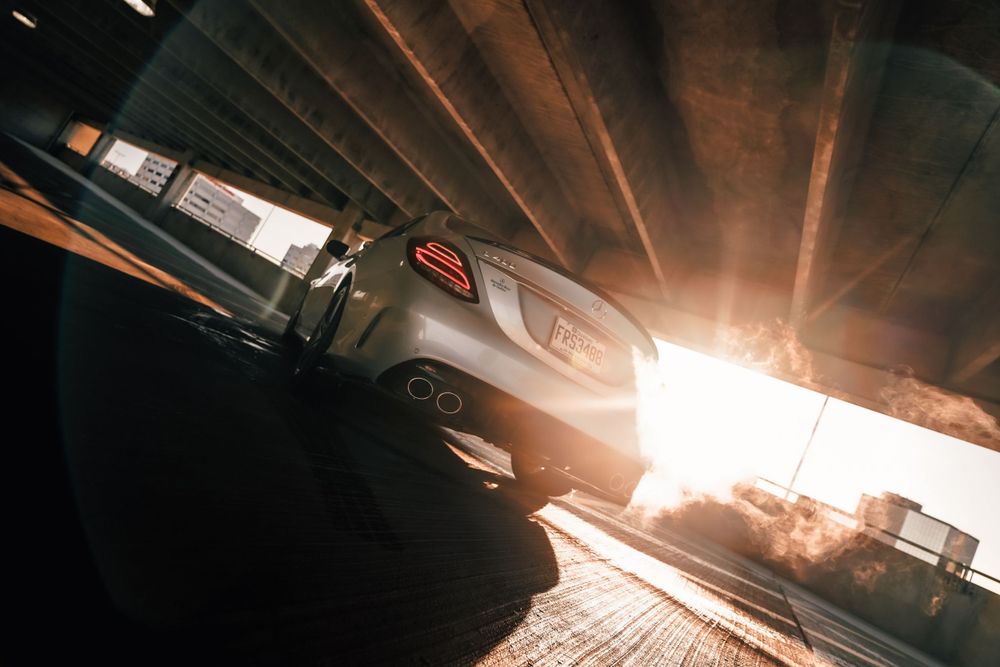 Mercedes-AMG photographed at dramatic angle with sunburst lighting effect. Mtlshutter photography