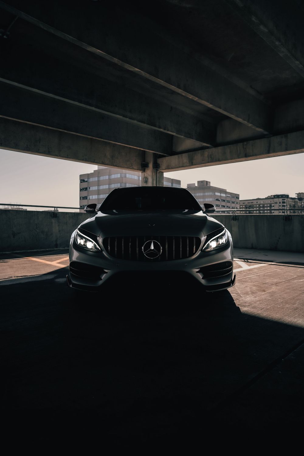Front view of Mercedes-AMG with distinctive Panamericana grille in moody lighting. Mtlshutter photography