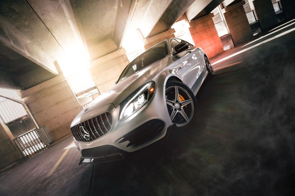 Mercedes-Benz sports car with dramatic lighting in a parking garage setting. Mtlshutter photography