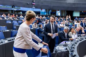 Politicians gathered in a large European Parliament chamber during a formal legislative session with delegates seated in rows.