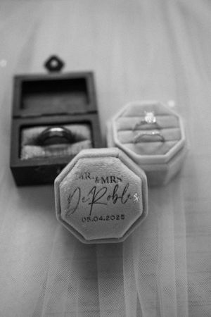 Wedding rings displayed in black and white with Mr and Mrs DePablo inscription dated 08.04.2023.