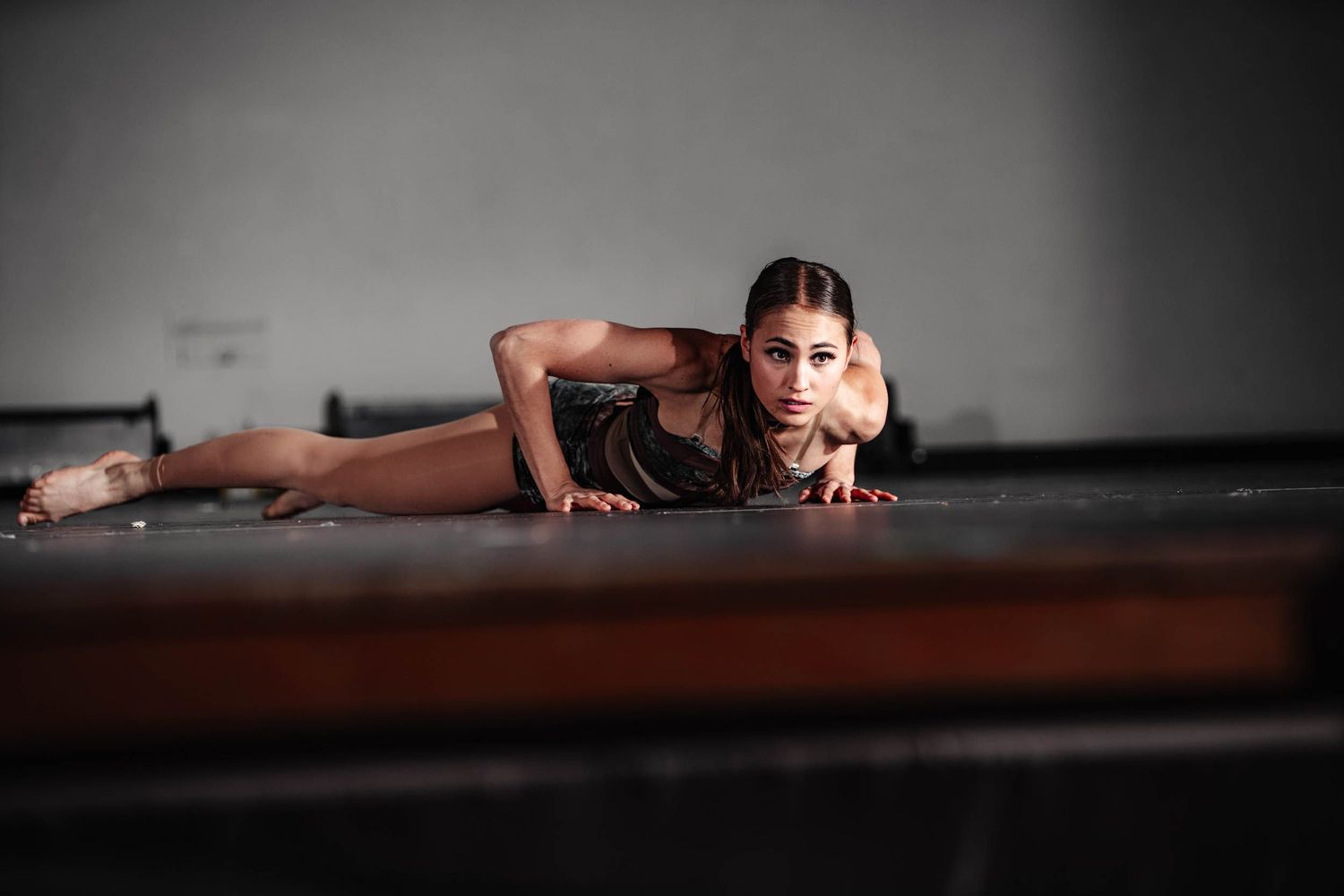 Flagstaff dancer Alissa Keller is lying on the floor during her dance routine.