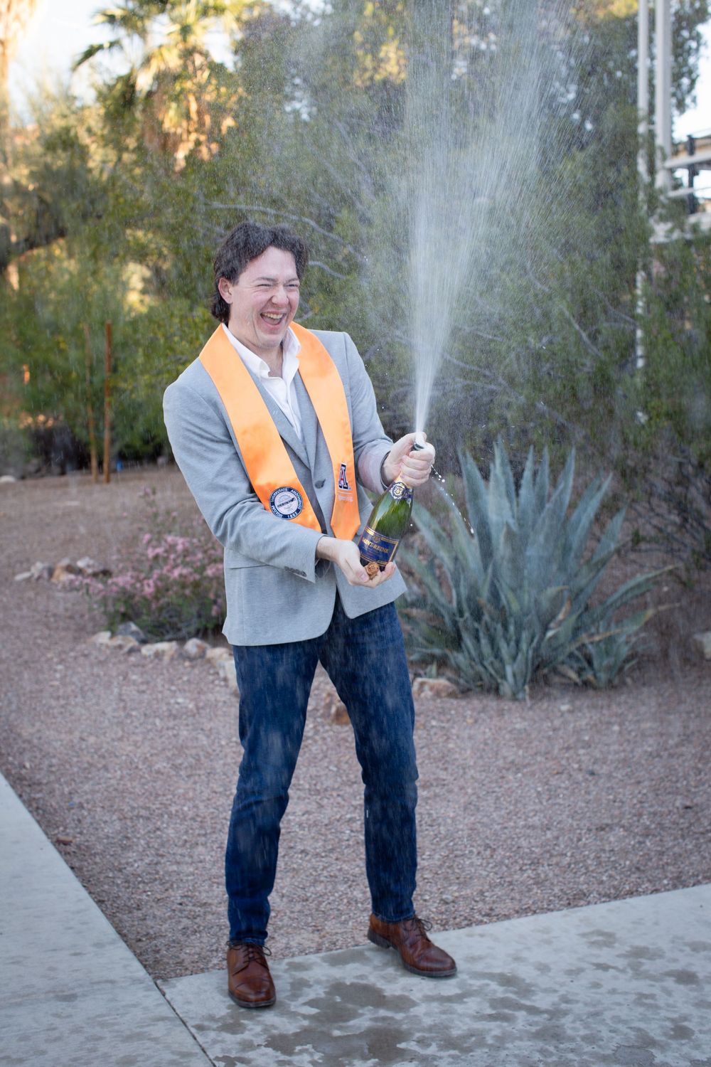 University of Arizona Graduation Photo with champagne