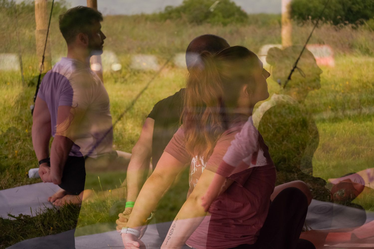 Multiple exposures of people relaxing outdoors create a dreamy overlapping effect in warm sunlight.