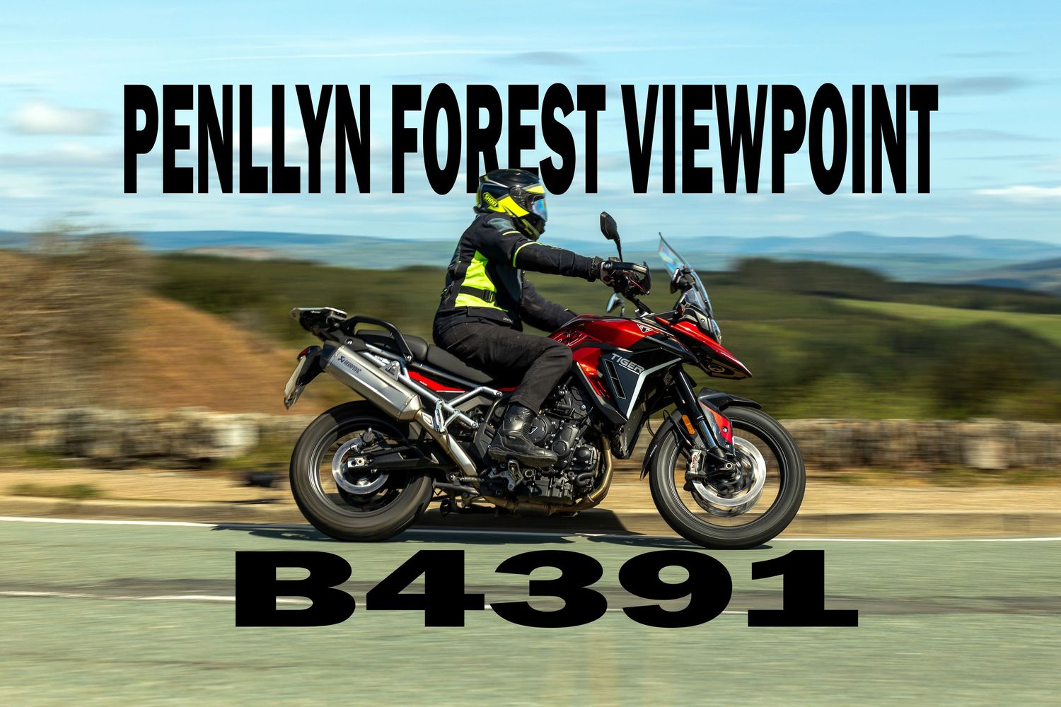 A motorcyclist rides a Monyash B5055 bike on a rural country road with another rider visible in the distance.