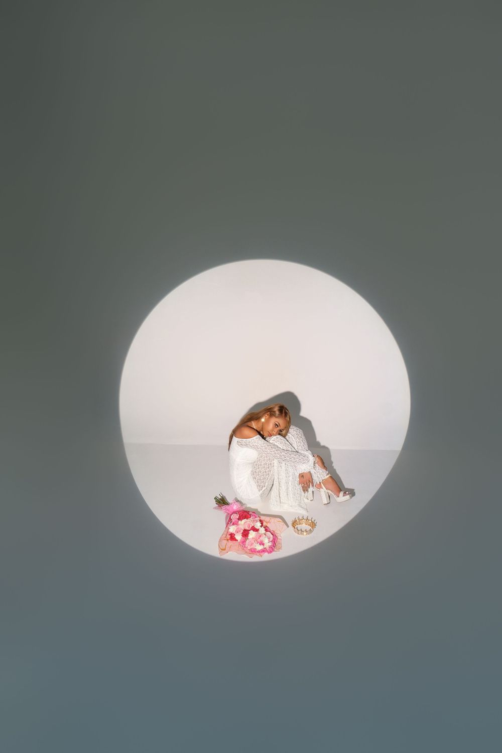 Sequence of four minimalist photos showing a small dog curled up sleeping inside a white dome-shaped space.