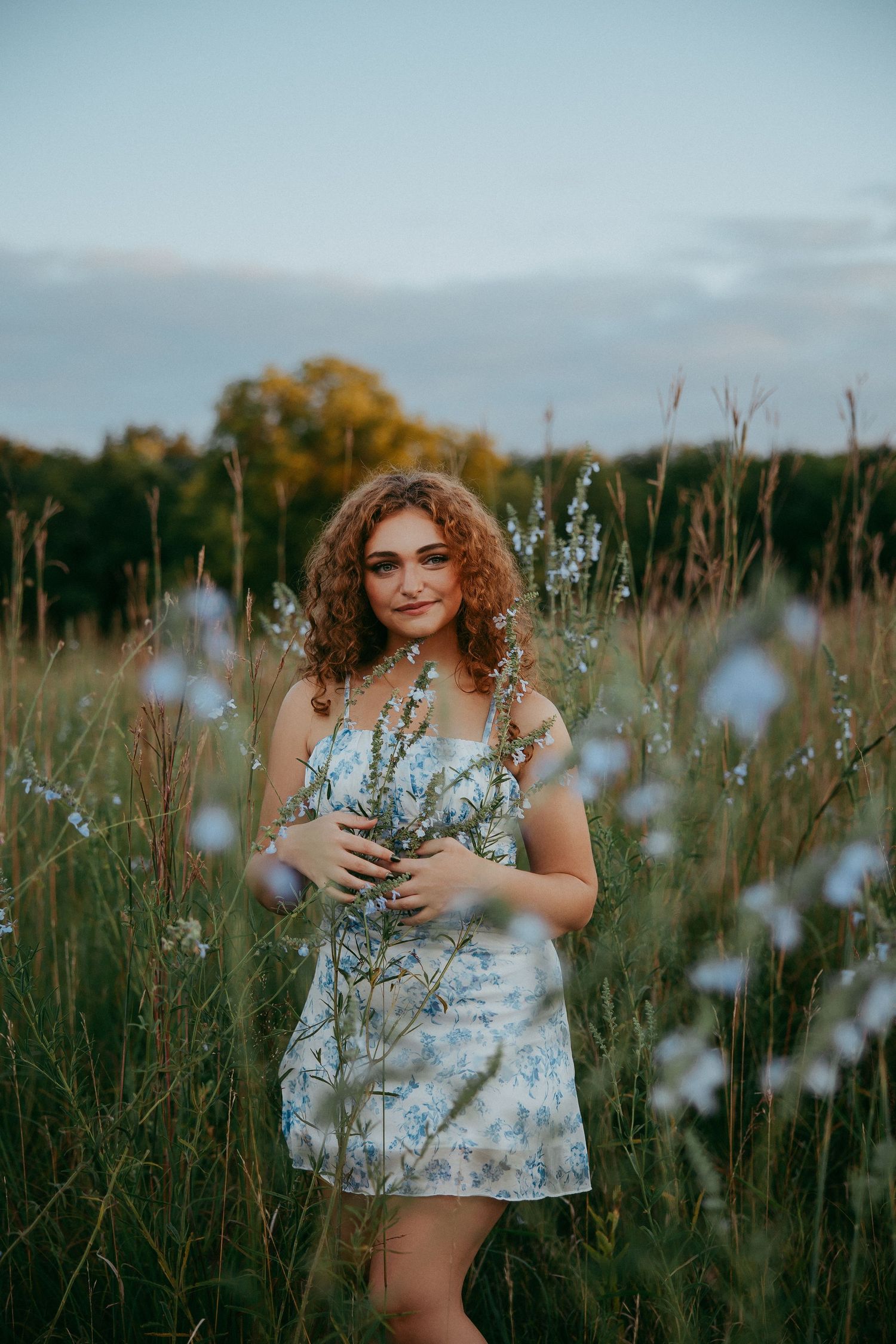 High school senior photos in Kansas captured in a field of wildflowers
