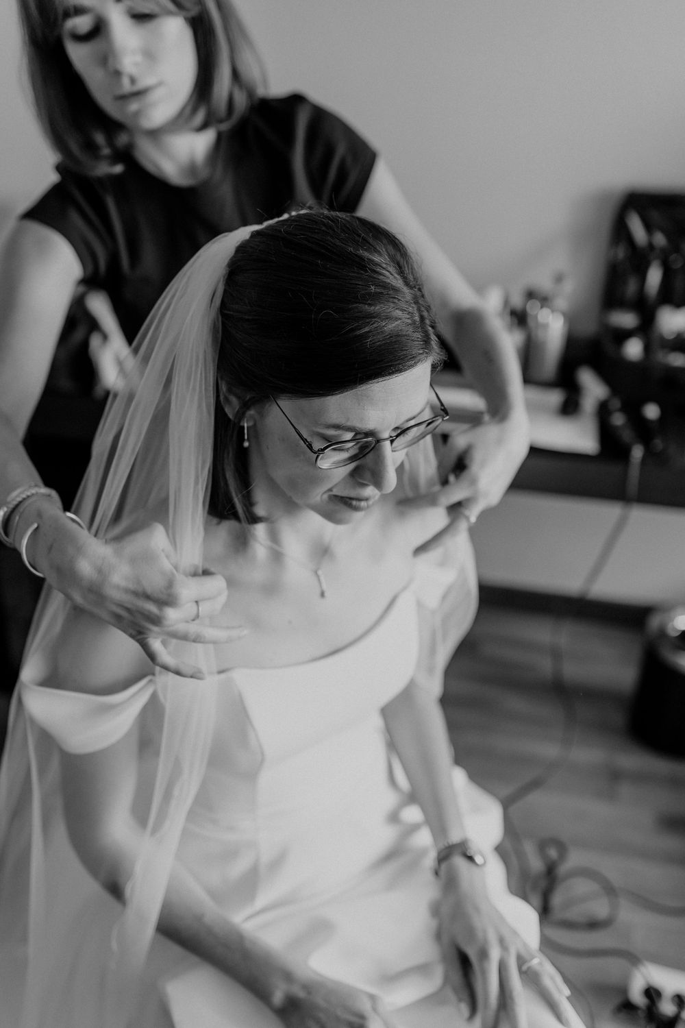 Wedding dress preparations being made in a sunlit room.