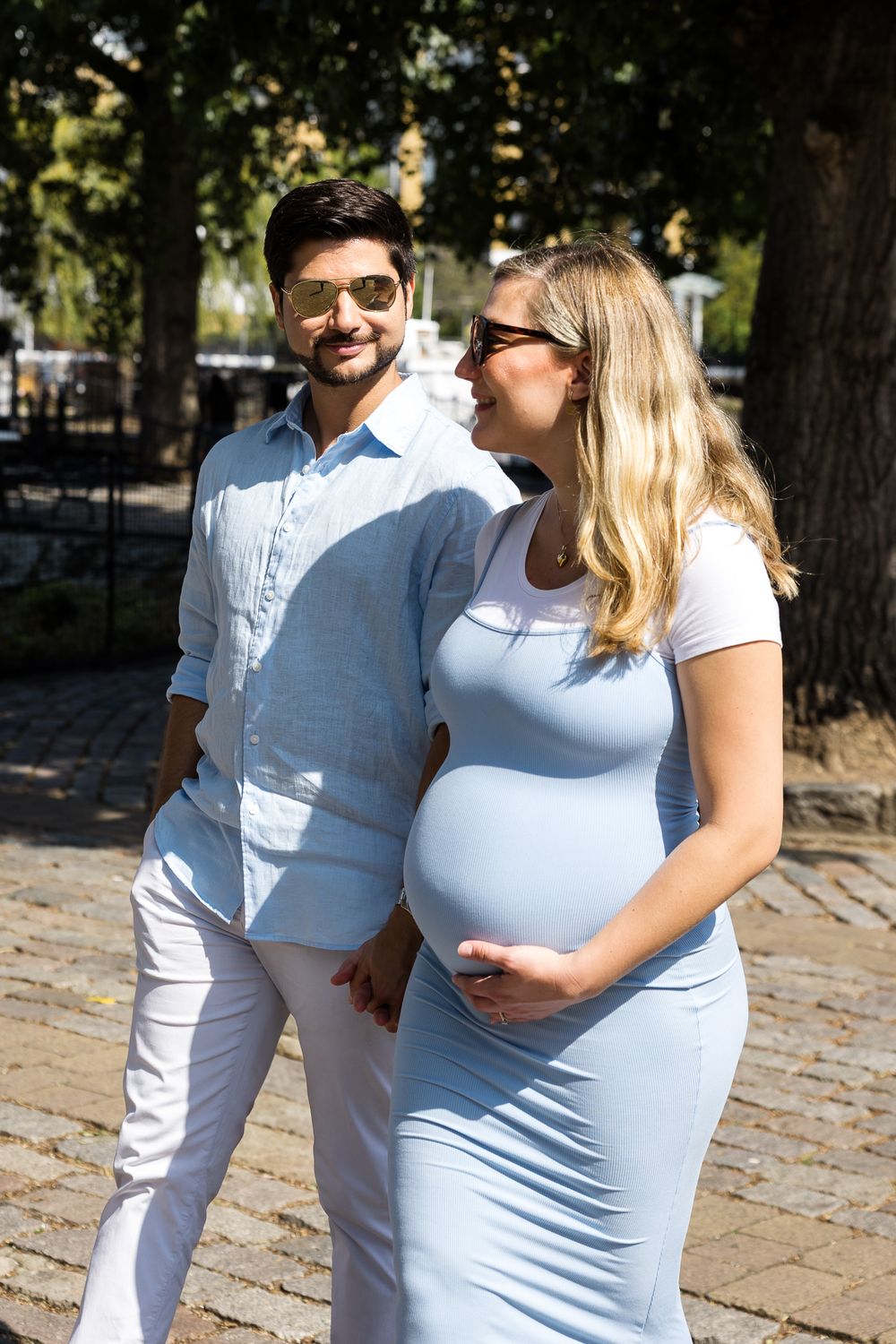 husband and wife walking around st Katharine docks in wapping london