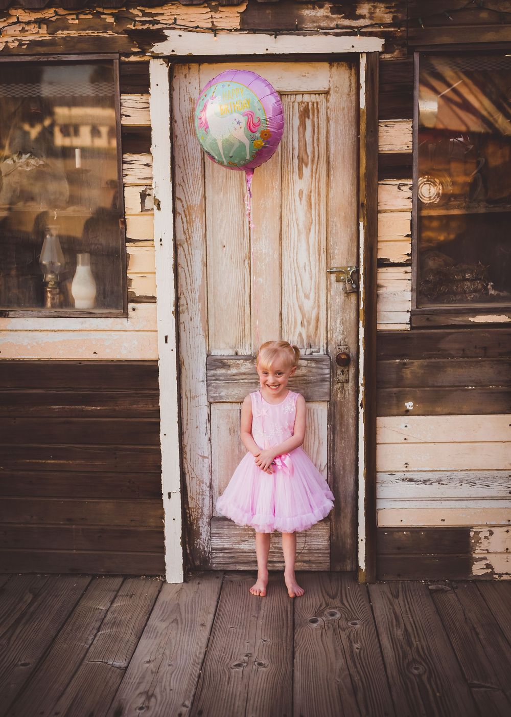 Beaumont, Ca children's photographer Heidi Grace captures small child for birthday photos.