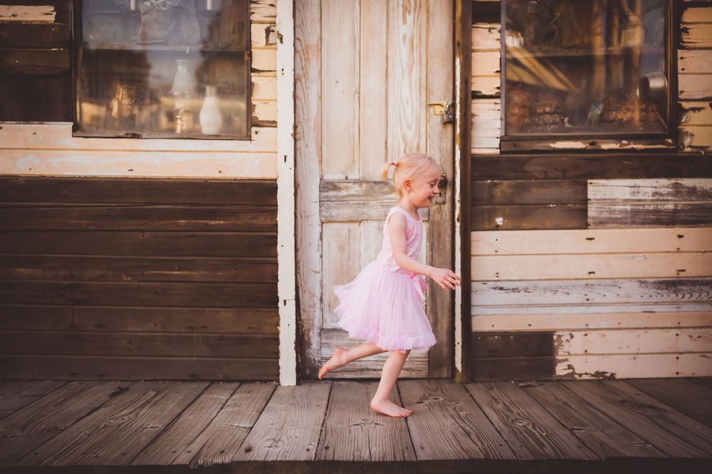 Little girl spinning in a tutu on her fourth birthday photo session Inland Empire outdoor family photographer.