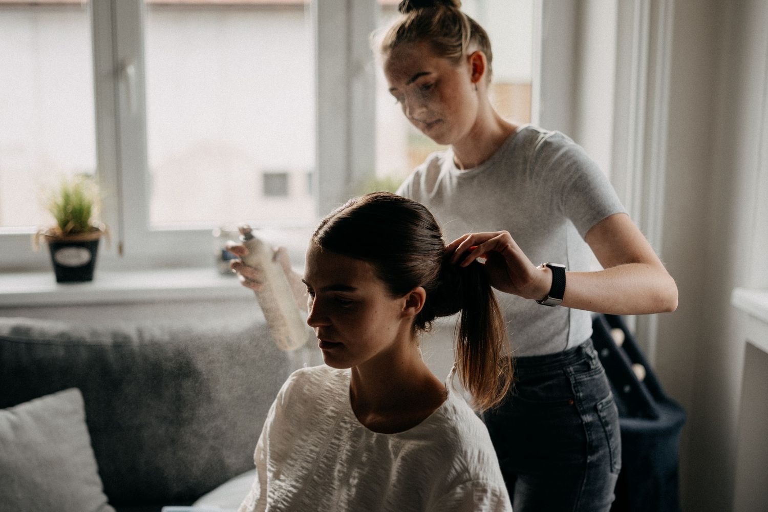 Indoor preparation scene with soft natural lighting and intimate moments.