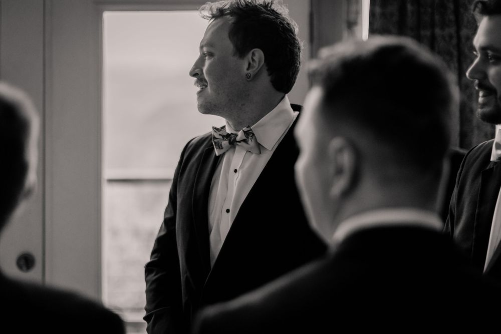 Black and white wedding party photos showing candid moments during the celebration.