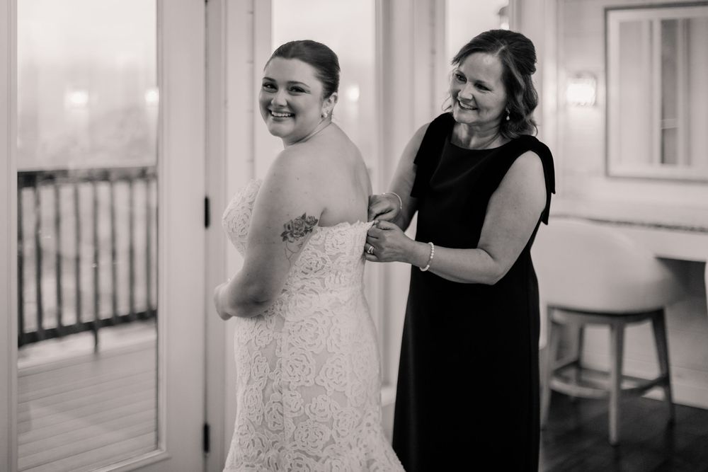 Bridesmaids share an emotional moment with the bride in a touching first look reveal.
