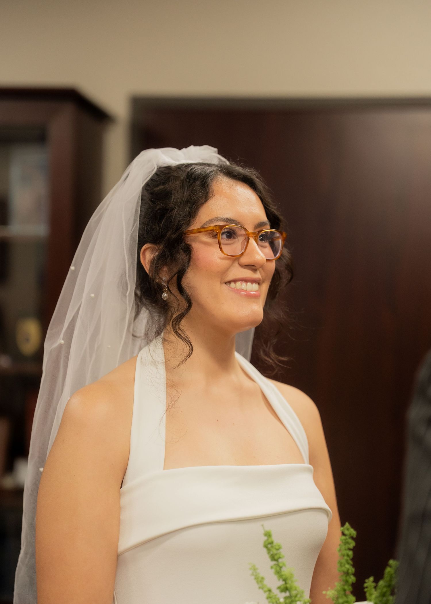 Rubi and Joe Yerena exchanging vows in a small, intimate courthouse ceremony in Houston, guided by a friendly judge.