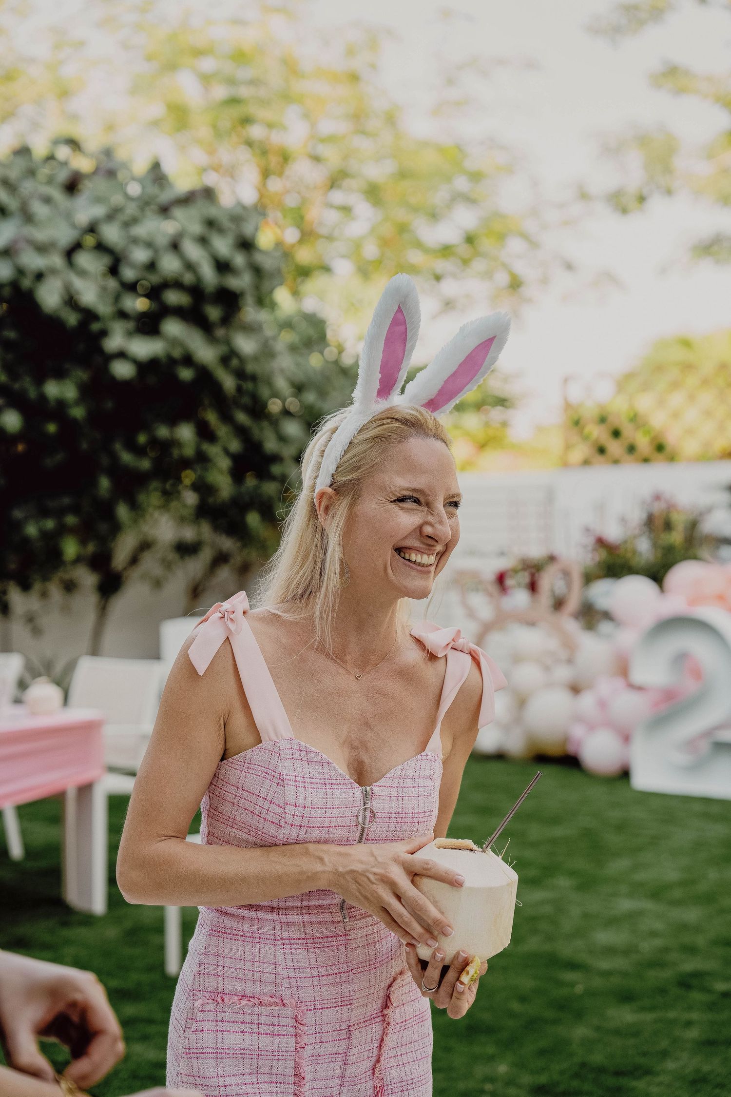 Mother smiling during outdoor birthday event in Dubai