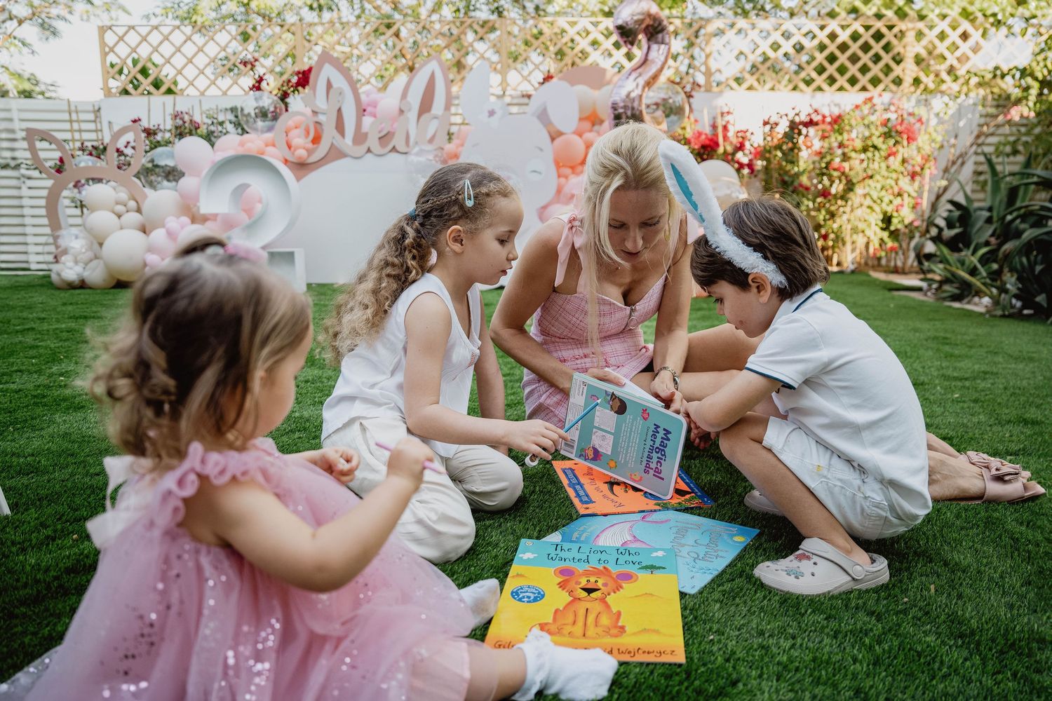 Children playing together on lawn at family celebration