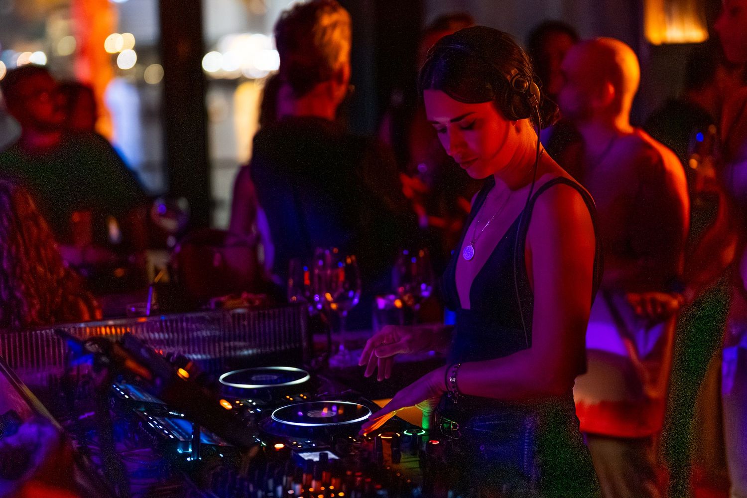 DJ playing music for crowd at nightlife event in Dubai