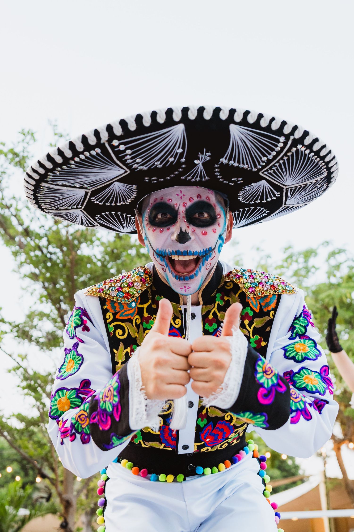Entertainer dressed in Day of the Dead costume at themed community event