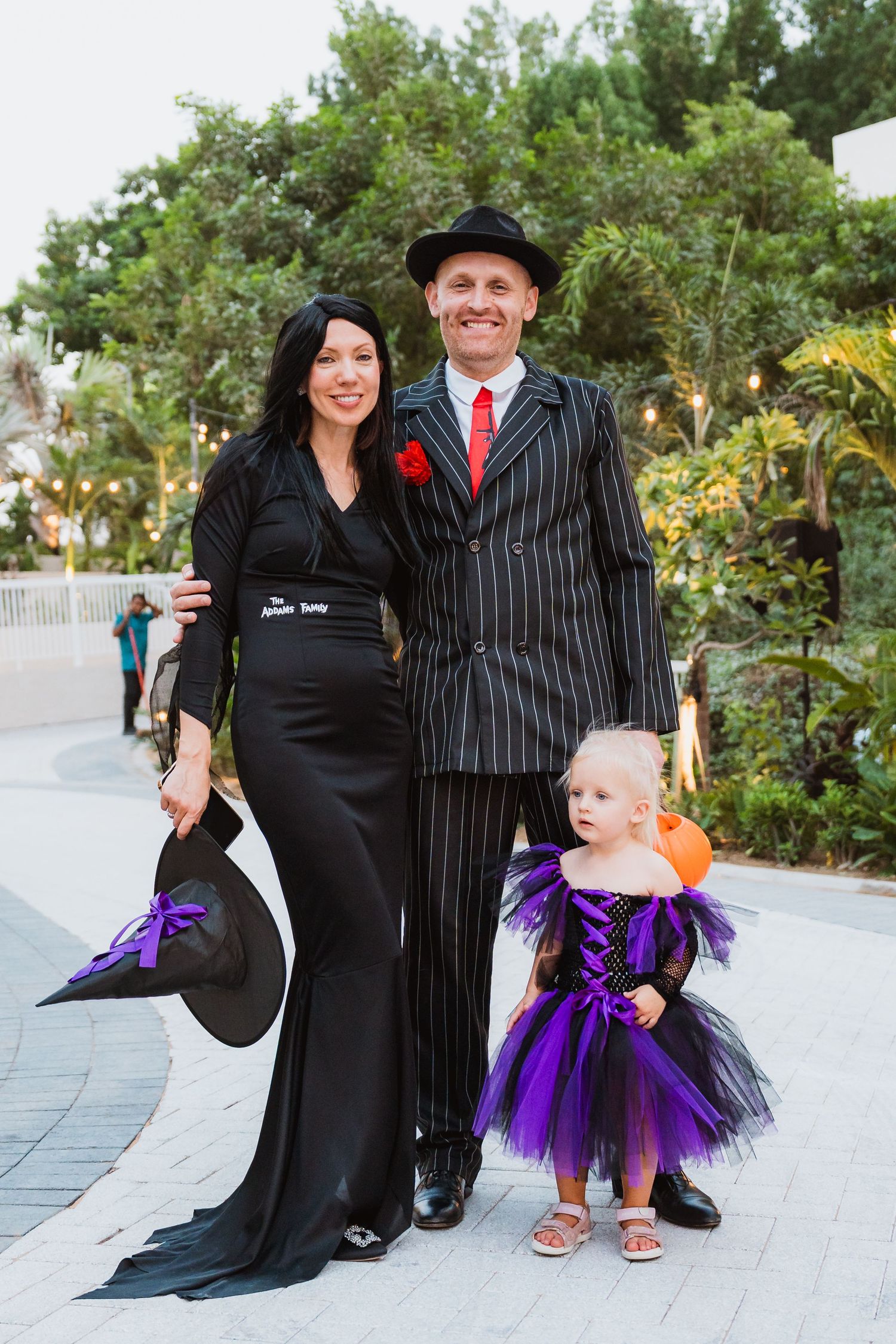Family dressed in Halloween costumes at community event