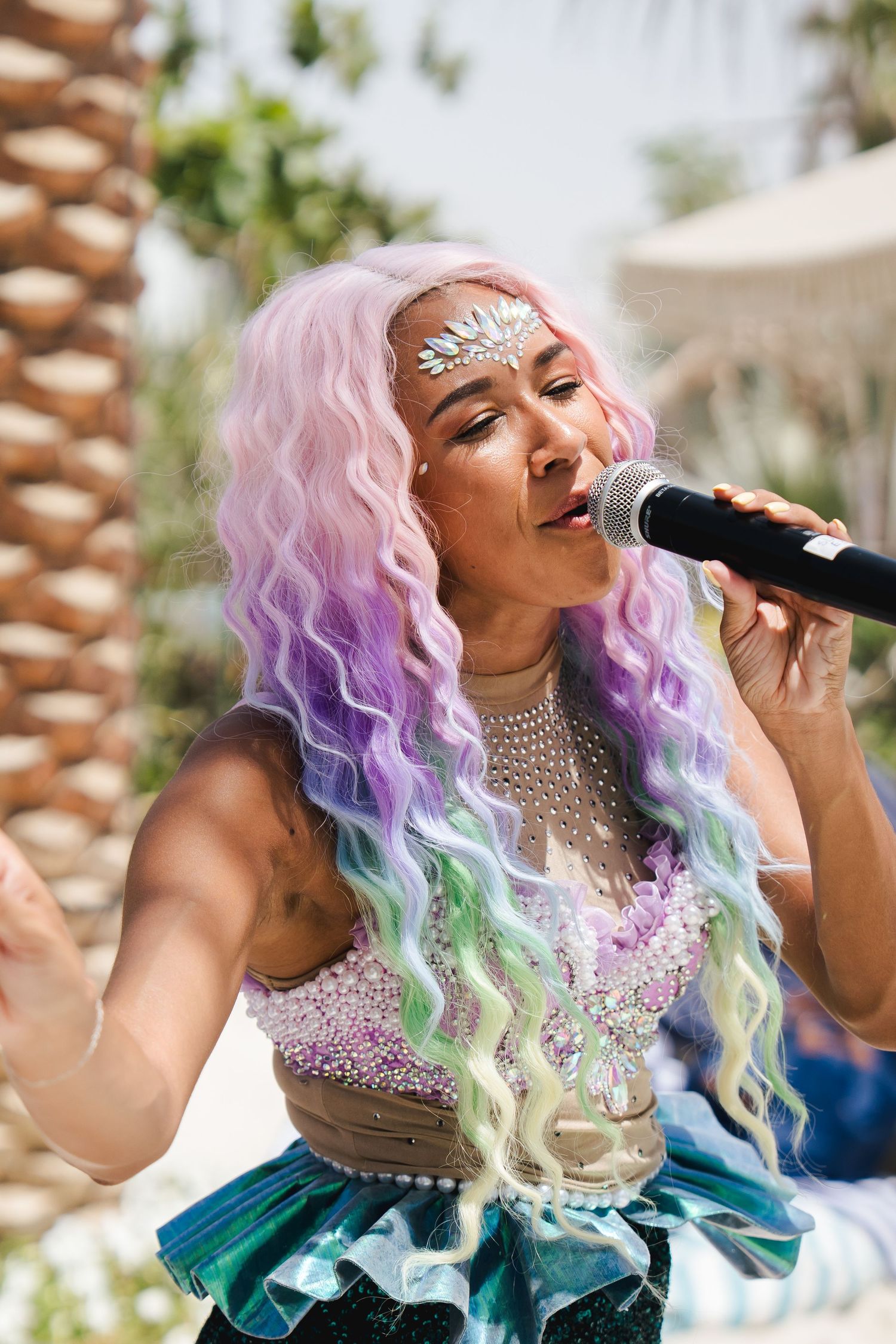 Live singer performing at a family pool event in Dubai