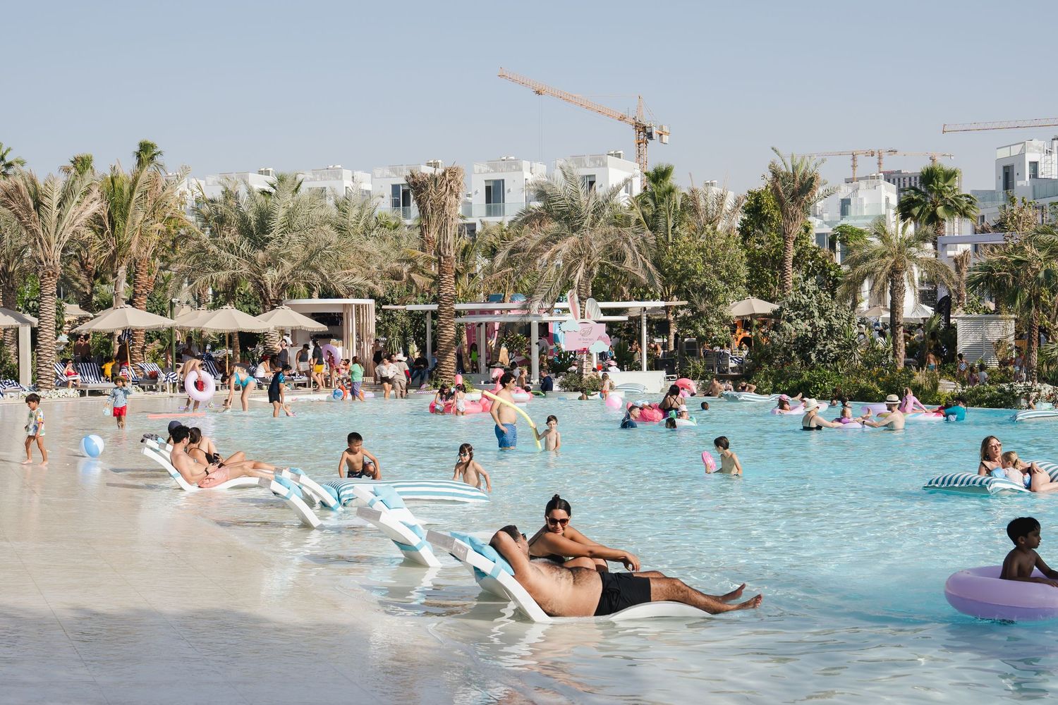 Families enjoying a poolside community event captured during event photography in Dubai