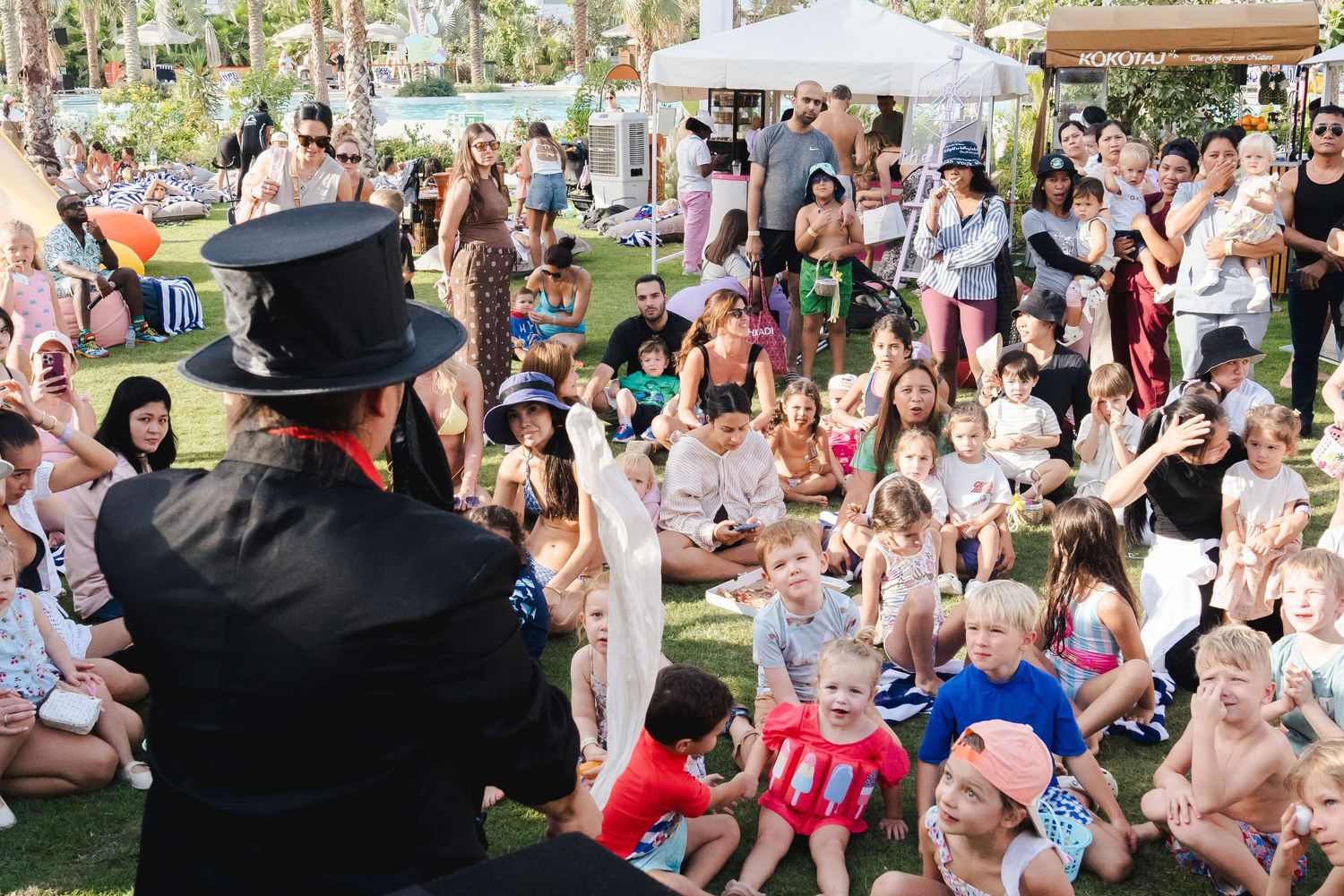 Live entertainer performing for children during an outdoor family event in Dubai