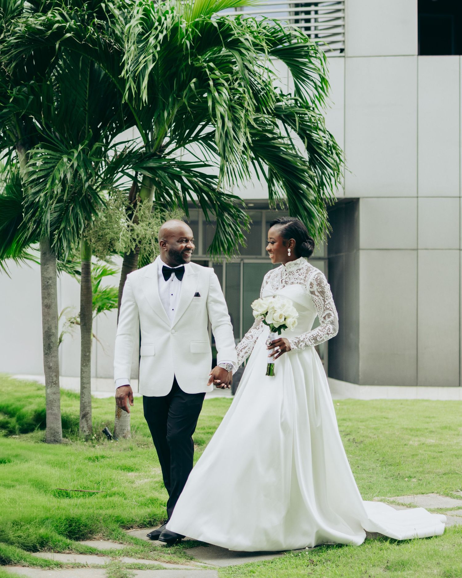 A wedding couple poses against a rustic wooden wall in a series of artistic minimalist portraits.