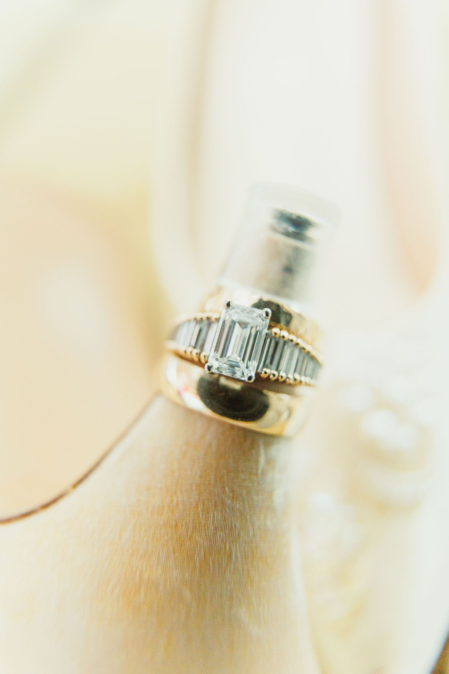 Macro shot of a diamond engagement ring with baguette cut stones.