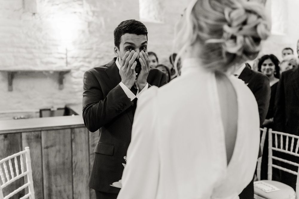 A sequence of candid wedding moments captured in black and white photography showing joyful interaction.