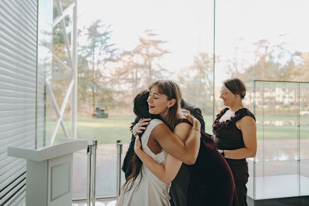 Bride hugging a guest at a wedding reception
