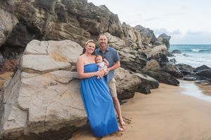 Maui family photographer photo against beautiful Maui beach cliff sunrise by ohwowfotos.