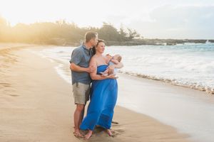 Maui family photographer photo against beautiful Maui beach cliff sunrise by ohwowfotos.