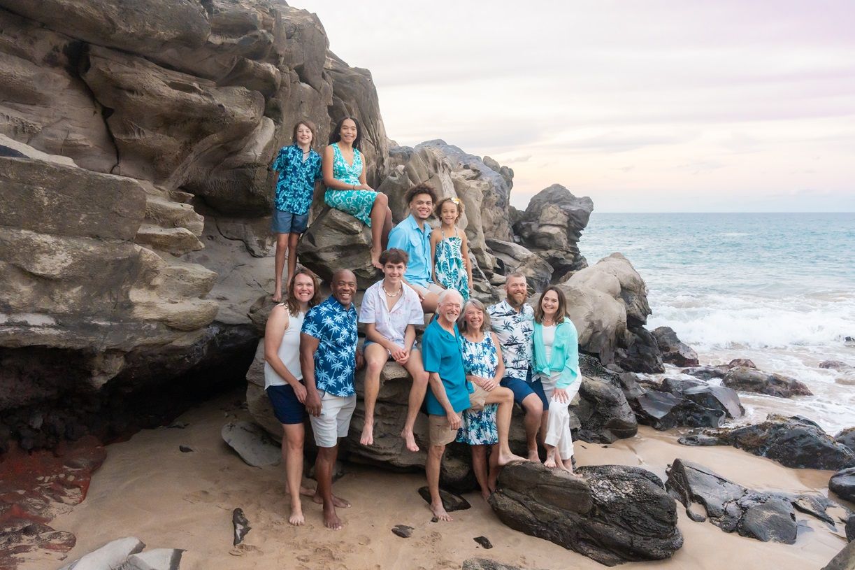 Maui family photographer photo against beautiful Maui beach cliff sunset by ohwowfotos.