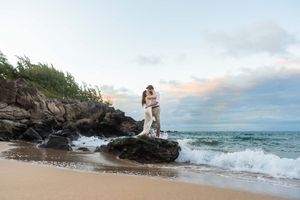 Maui couple engagement photographer photo against beautiful Maui beach sunset by ohwowfotos.
