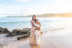 Maui family photographer photo against beautiful Maui beach cliff sunrise by ohwowfotos.