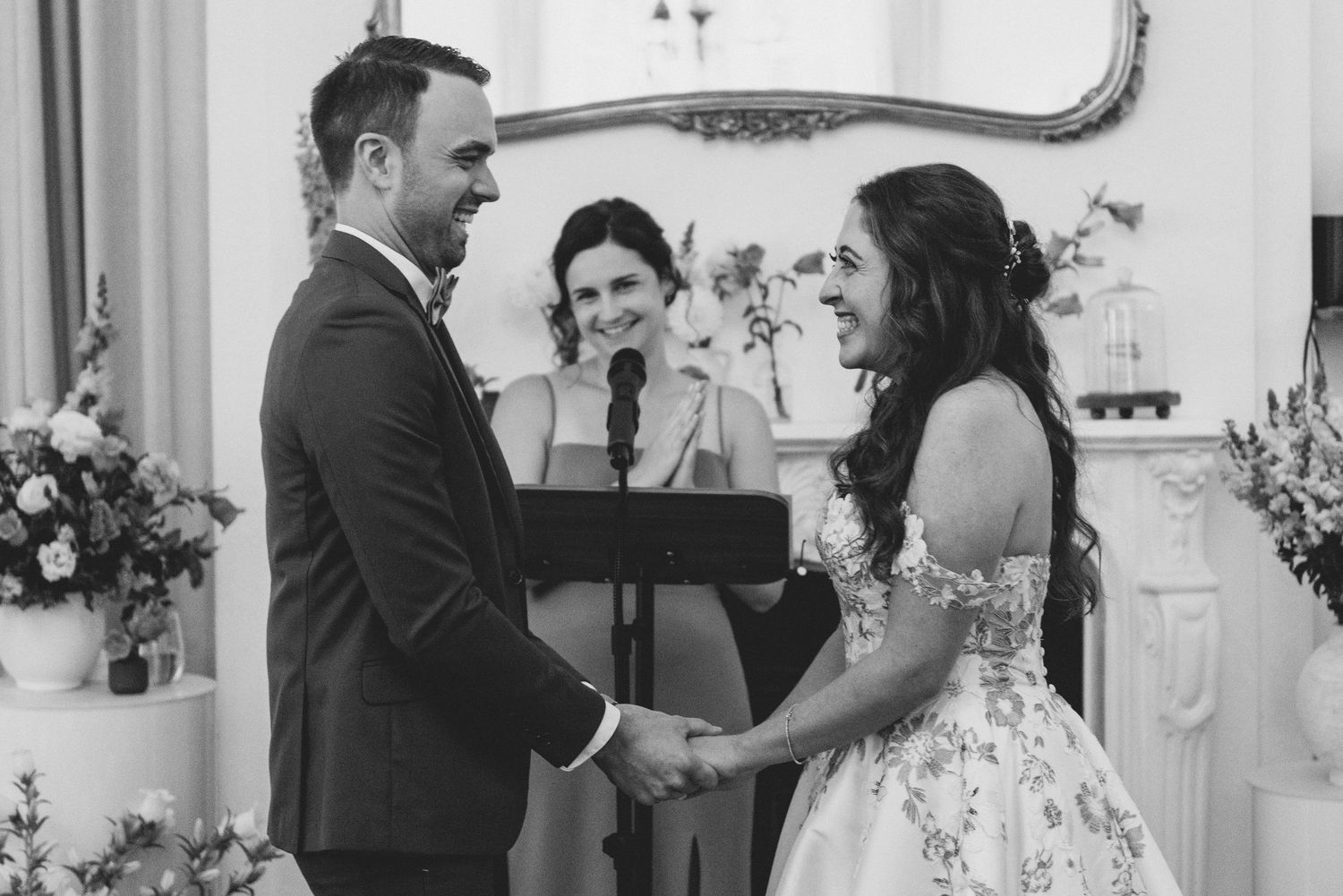 Black and white collage of candid wedding moments showing couples dancing and celebrating at an elegant reception.