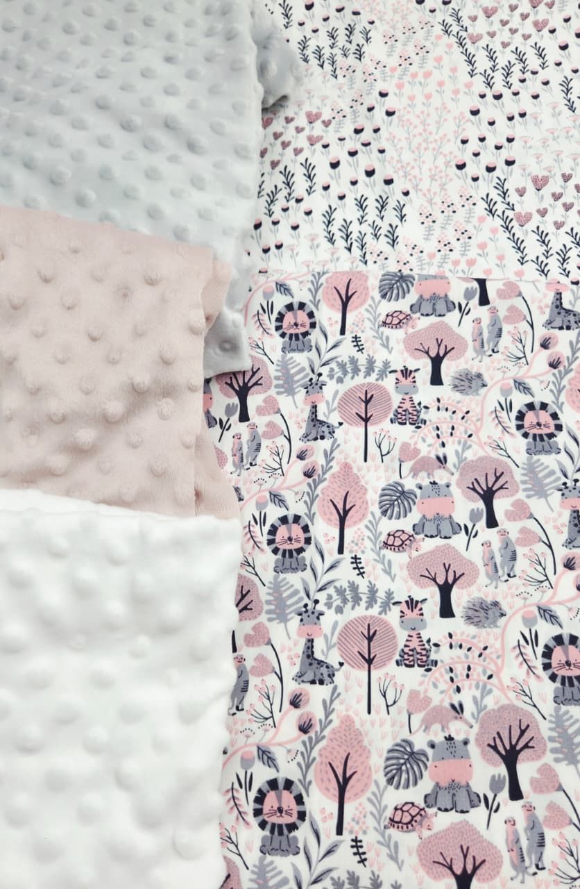 Pink and gray minky dot baby blanket with woodland animals, trees, and hearts pattern fabric.