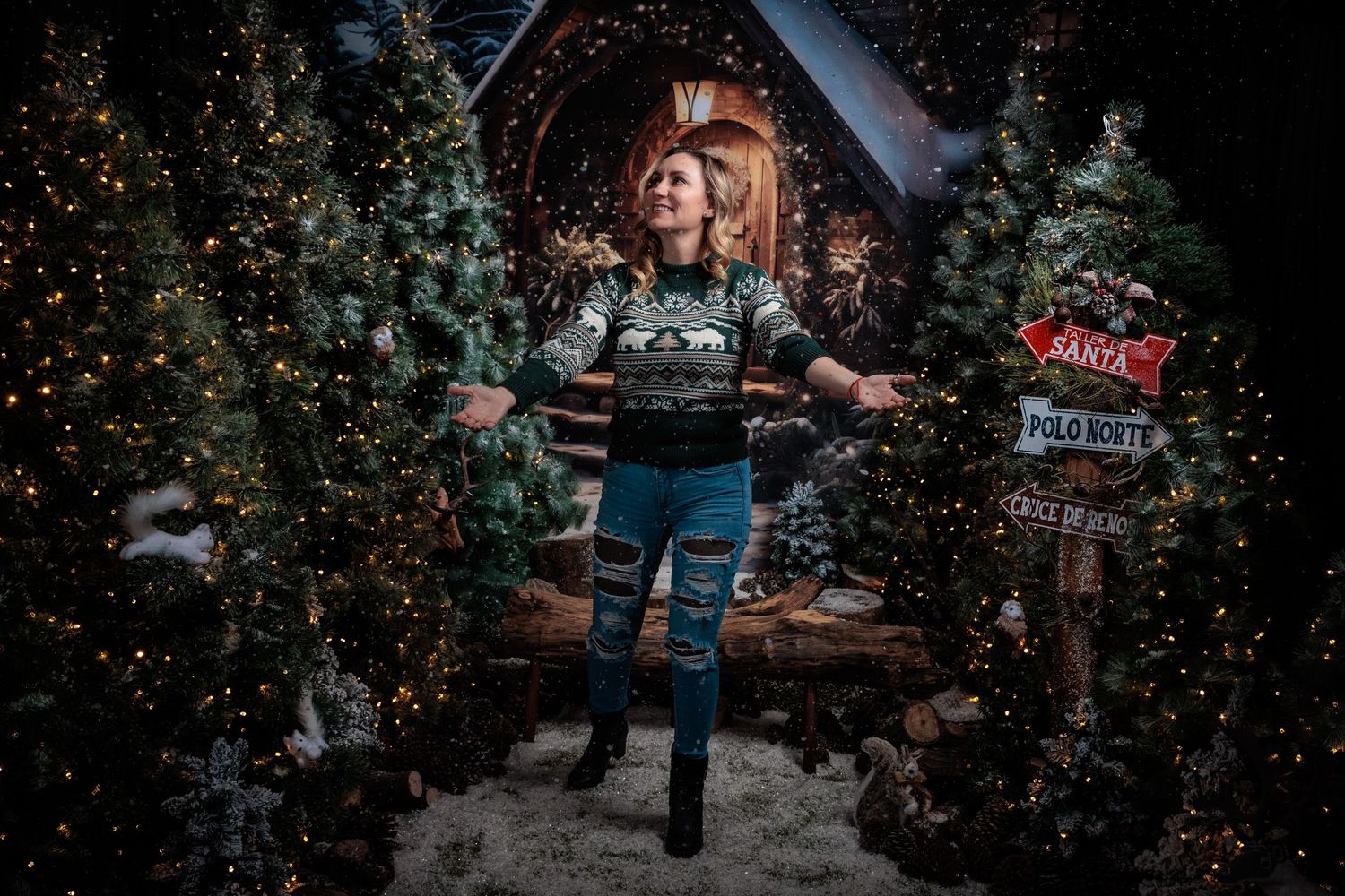 Holiday scene with multiple decorated Christmas trees and twinkling lights creating a magical atmosphere.