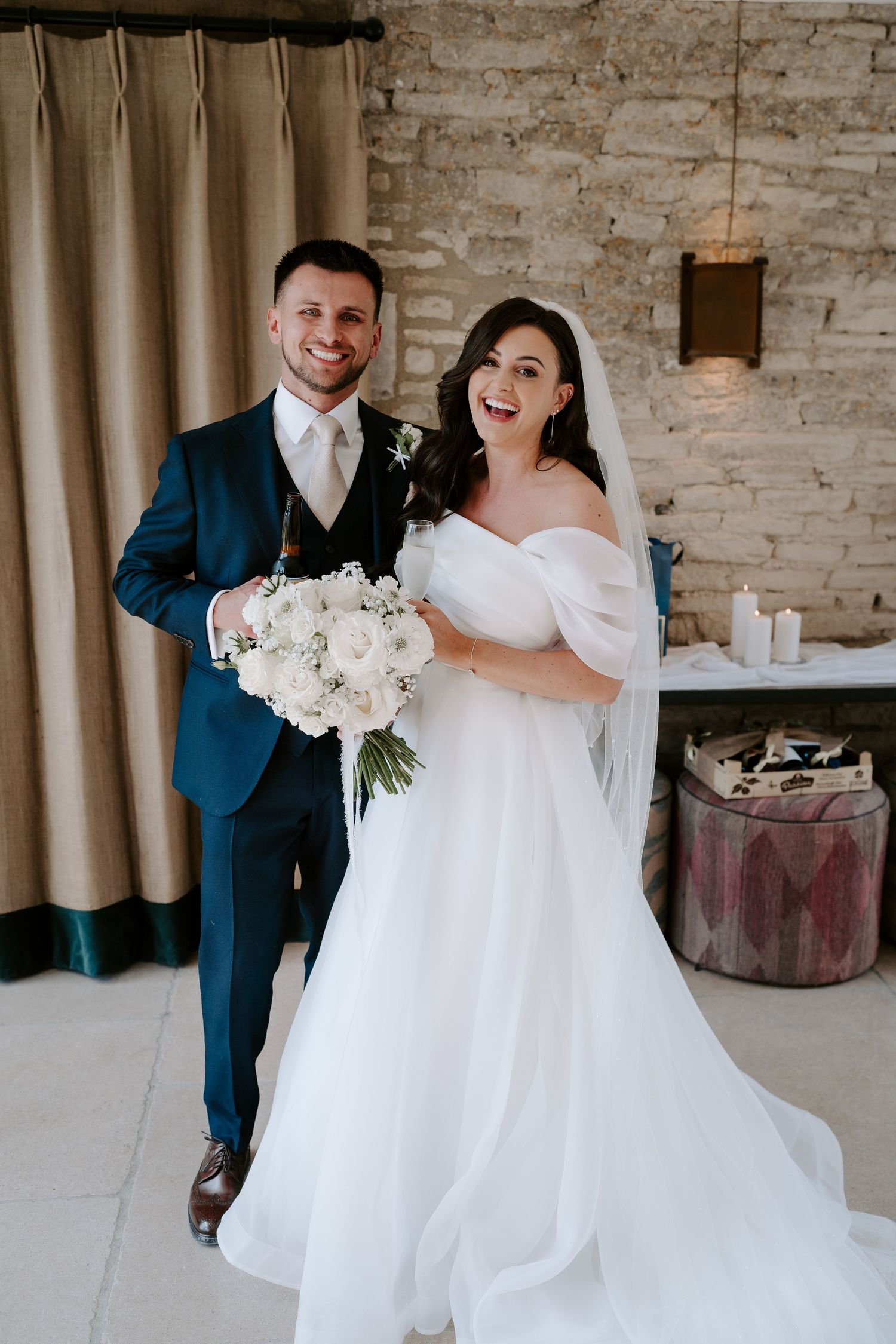 bride and groom laughing after ceremony at yardspace old gore in cirencester